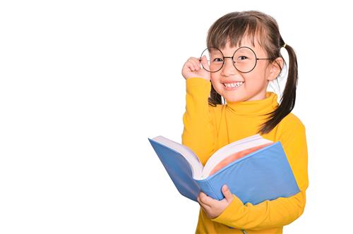 Girl in yellow sweater holding book